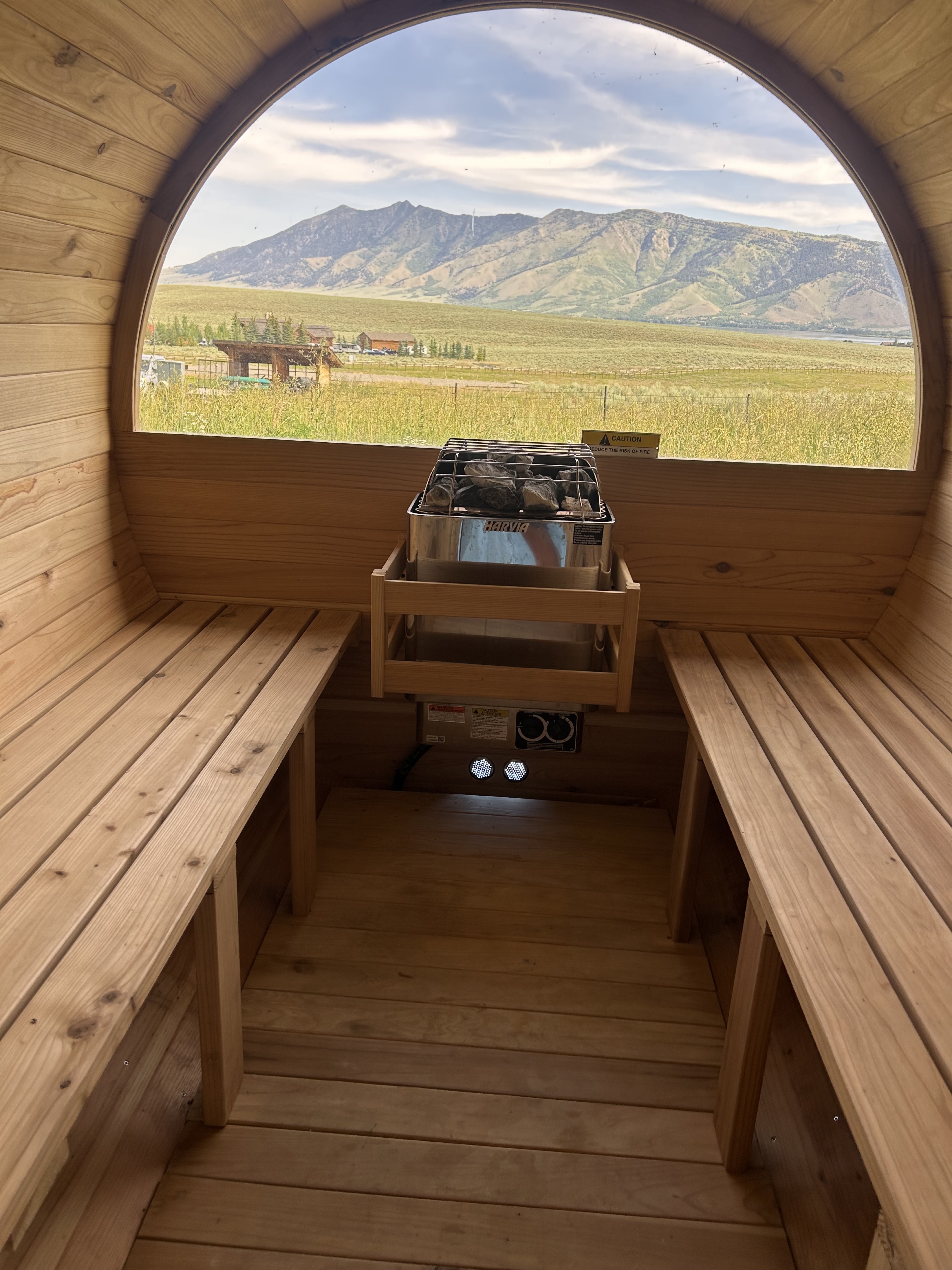 View from a wooden sauna with mountain backdrop